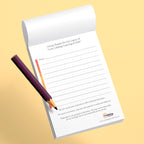 Notebook with a pen on a yellow background