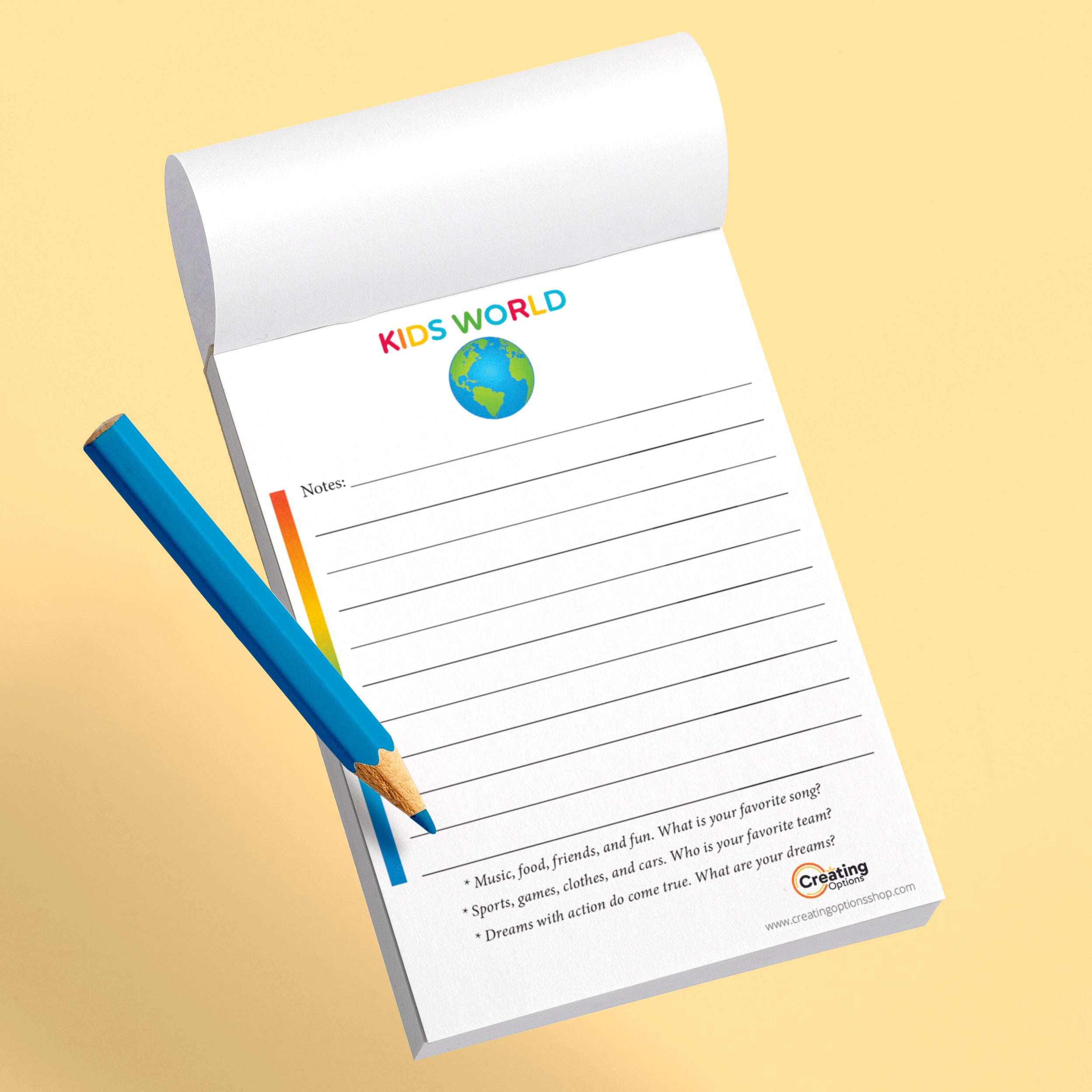 Notepad with 'Kids World' branding and a pencil on a beige background